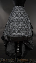Skull brocade layer bustle skirt with the front lowered