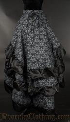 Back view of women's skull brocade bustle skirt showing three layers of fabric in the back and adjustable lacing in the waist