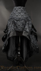 Women's black and grey skull brocade bustle skirt with the front of the skirt raised