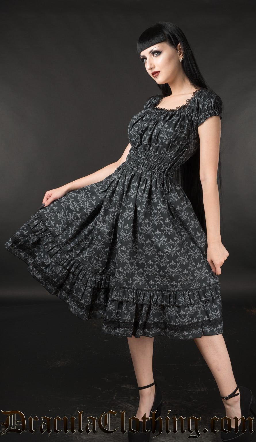 Model wearing black skull damask printed knee length dress