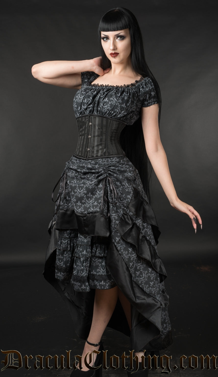 Model wearing skull brocade bustle skirt over matching dress