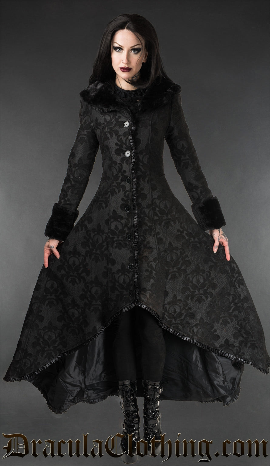 Women's thick black button up high low coat with black skull brocade pattern faux fur collar and sleeve cuffs