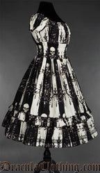 Side view of black and white striped printed skull and candelabra dress for women showing elasticated waist and sleeves