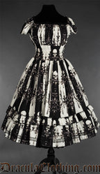 Women's black and white vertical striped dress with skull and candelabra design square neckline and black lace trim in the bust