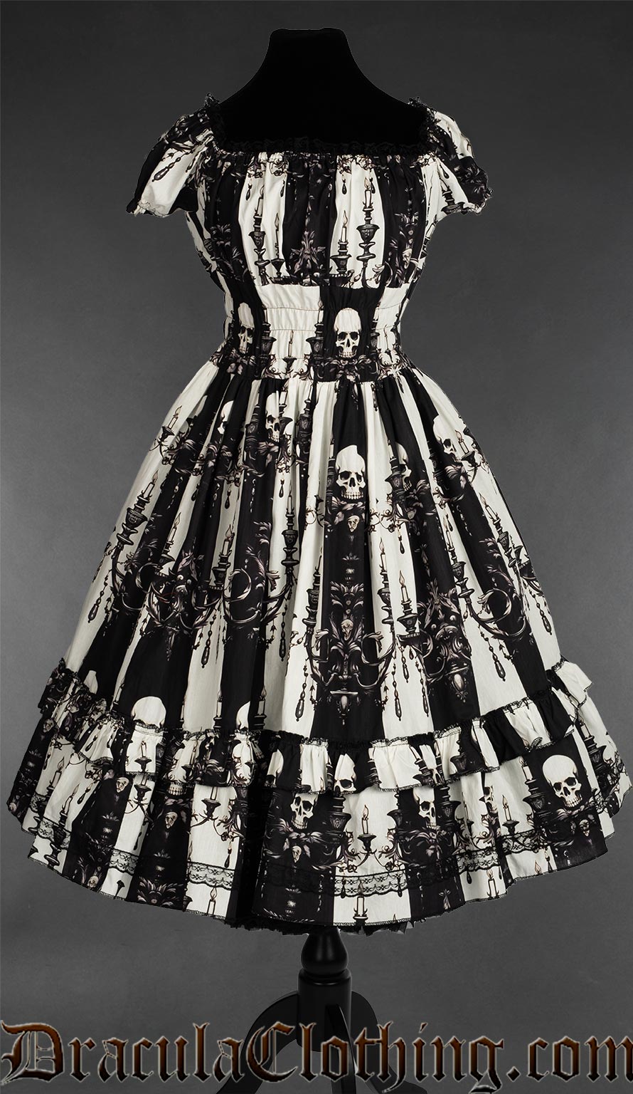 Women's black and white vertical striped dress with skull and candelabra design square neckline and black lace trim in the bust
