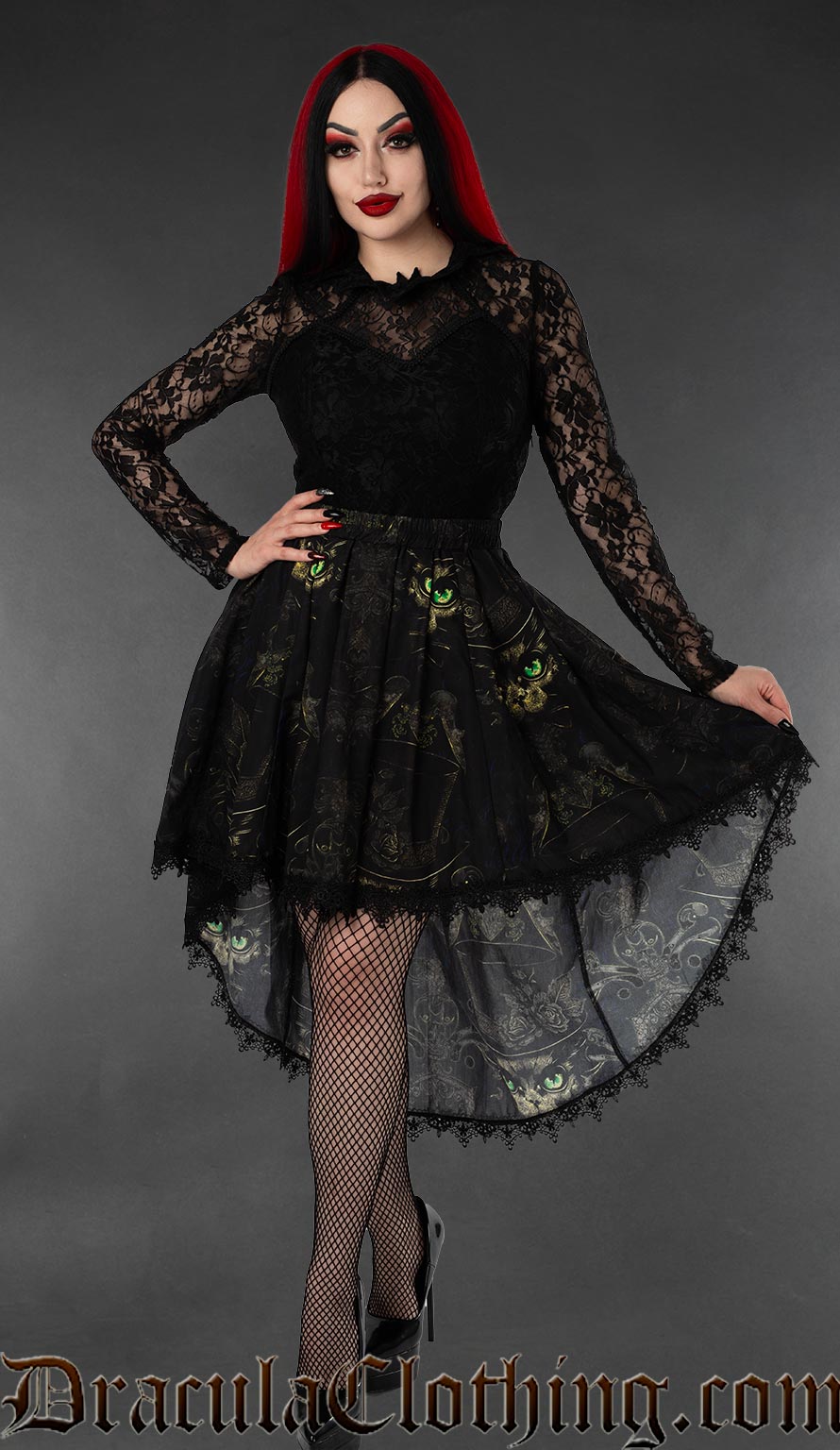Women's high low skirt with black lace trim and printed sphinx cat design on a black background worn by a model