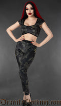 Black sphinx print velvet leggings styled on a model
