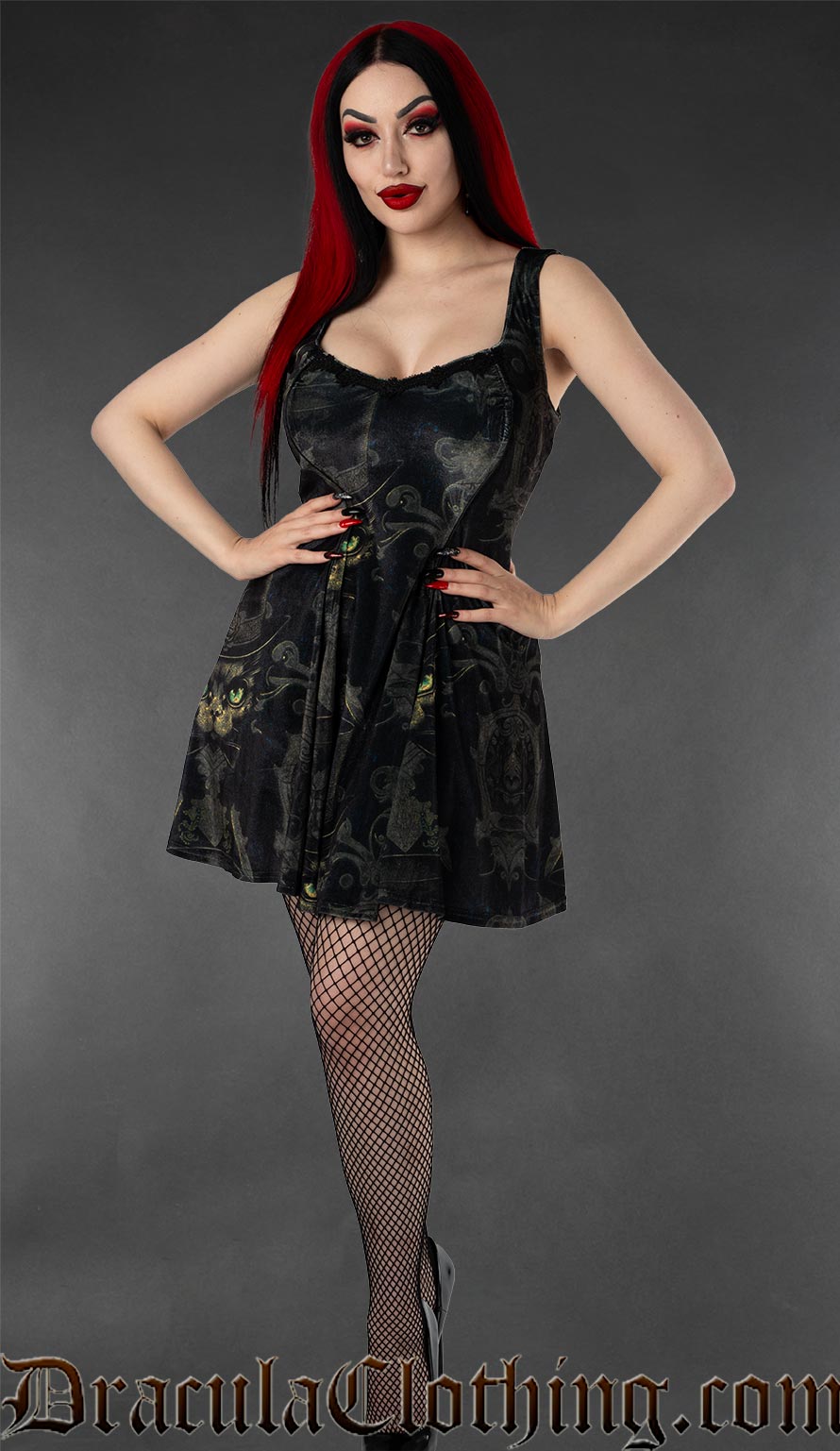 Women's short sleeveless dress with pockets made with printed velvet featuring an ornate sphinx cat design on a black background