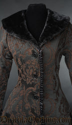 Close up of the faux fur collar and satin trim details on a black and brown  damask patterned brocade women's coat