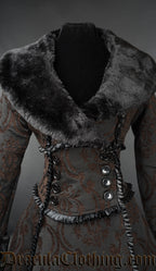 Close up front view of women's winter coat showing black faux fur collar wrap closure and frilled black satin trim details