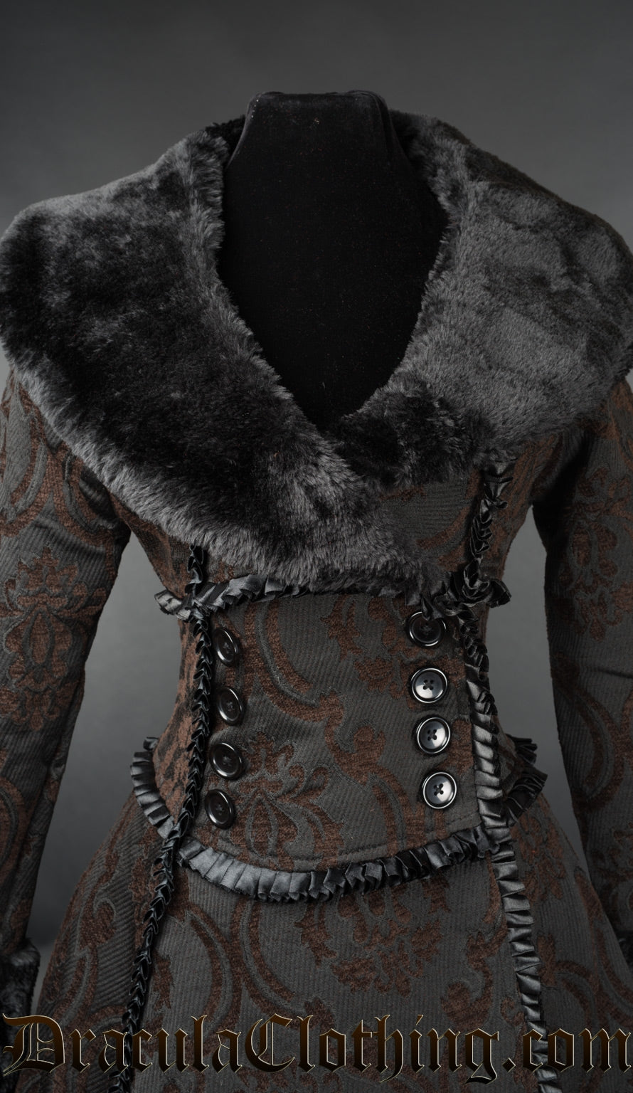 Close up front view of women's winter coat showing black faux fur collar wrap closure and frilled black satin trim details