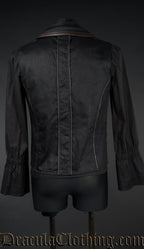 Back view of men's black tesla vest showing brown faux leather piping on back and collar