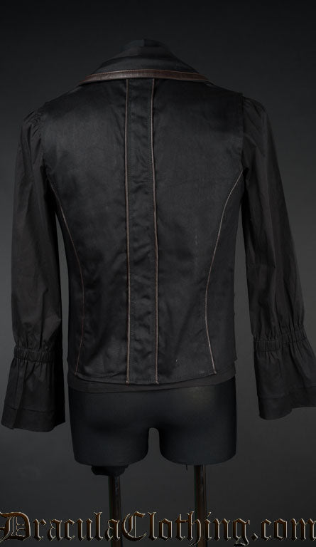 Back view of men's black tesla vest showing brown faux leather piping on back and collar