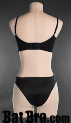 Back view of satin strap bra, showing standard bra hook fastening in the back