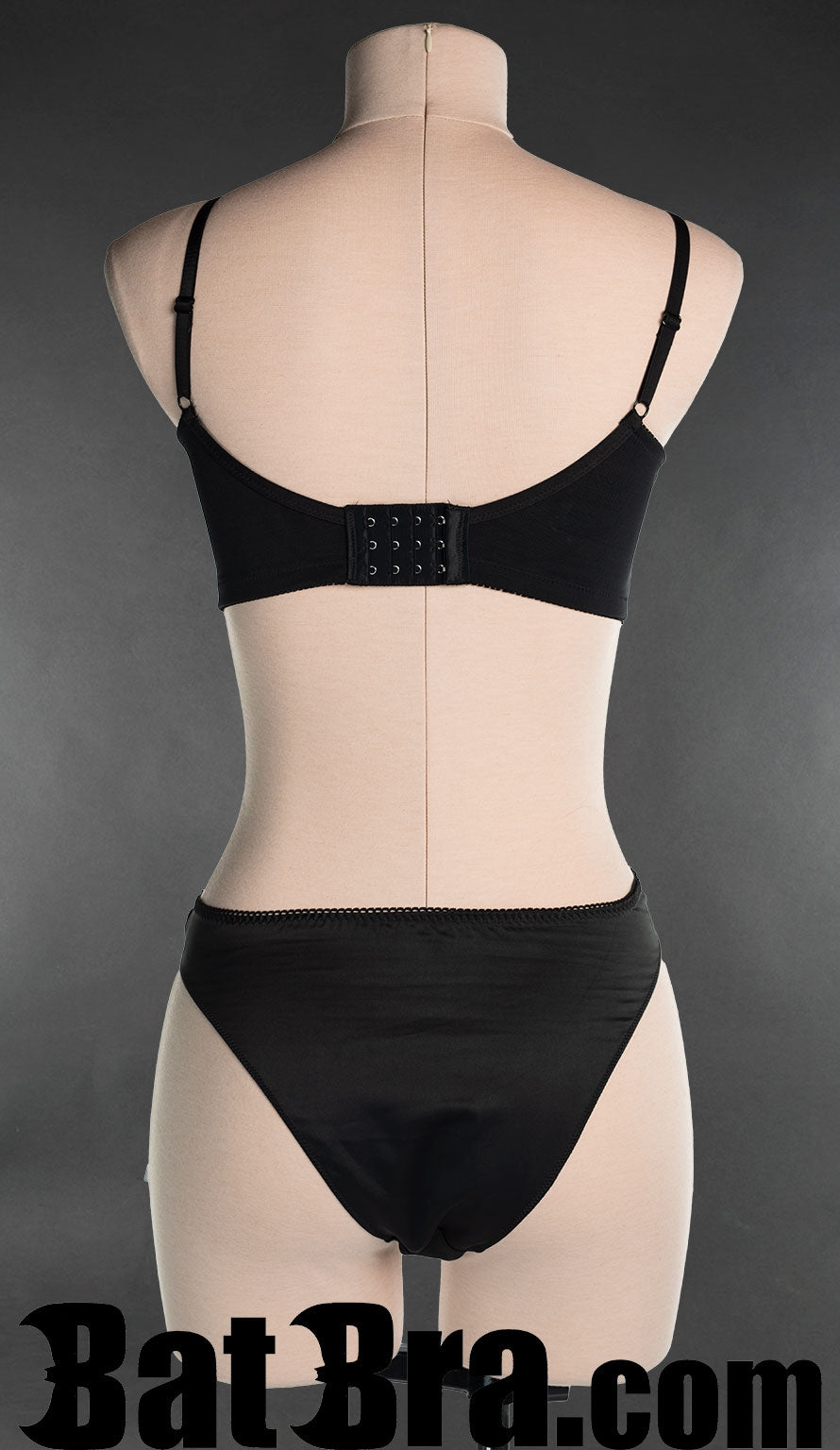 Back view of satin strap bra, showing standard bra hook fastening in the back