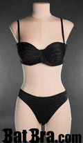 Women's black satin bra with strap detail on cups