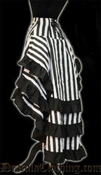 Side view of women's layered bustle skirt with black and white stripes showing three layers of fabric and adjustable lacing in the back