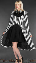 Model wearing women's black and white vertical striped EGA coat over black collared dress