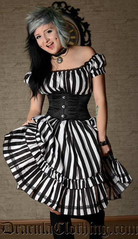 Women's knee length dress with black and white vertical striped cotton fabric worn with a waist cincher