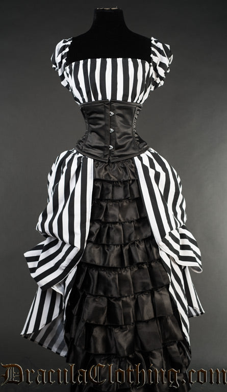 Women's black and white striped dress with centre panel in the skirt featuring a black satin ruffled section