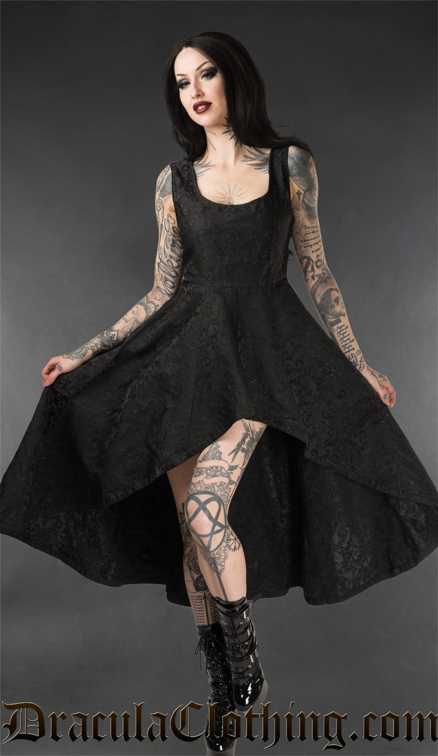 Women's black brocade cotton dress with high low hem as seen on a model