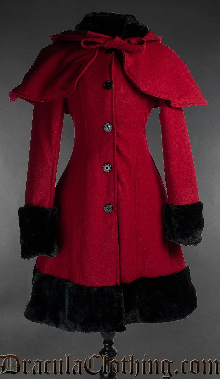 Women's red wool winter coat with faux fur accent and shown with attachable red cape