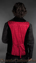 Back view of Men’s red brocade gothic vest with black velvet details worn over black shirt