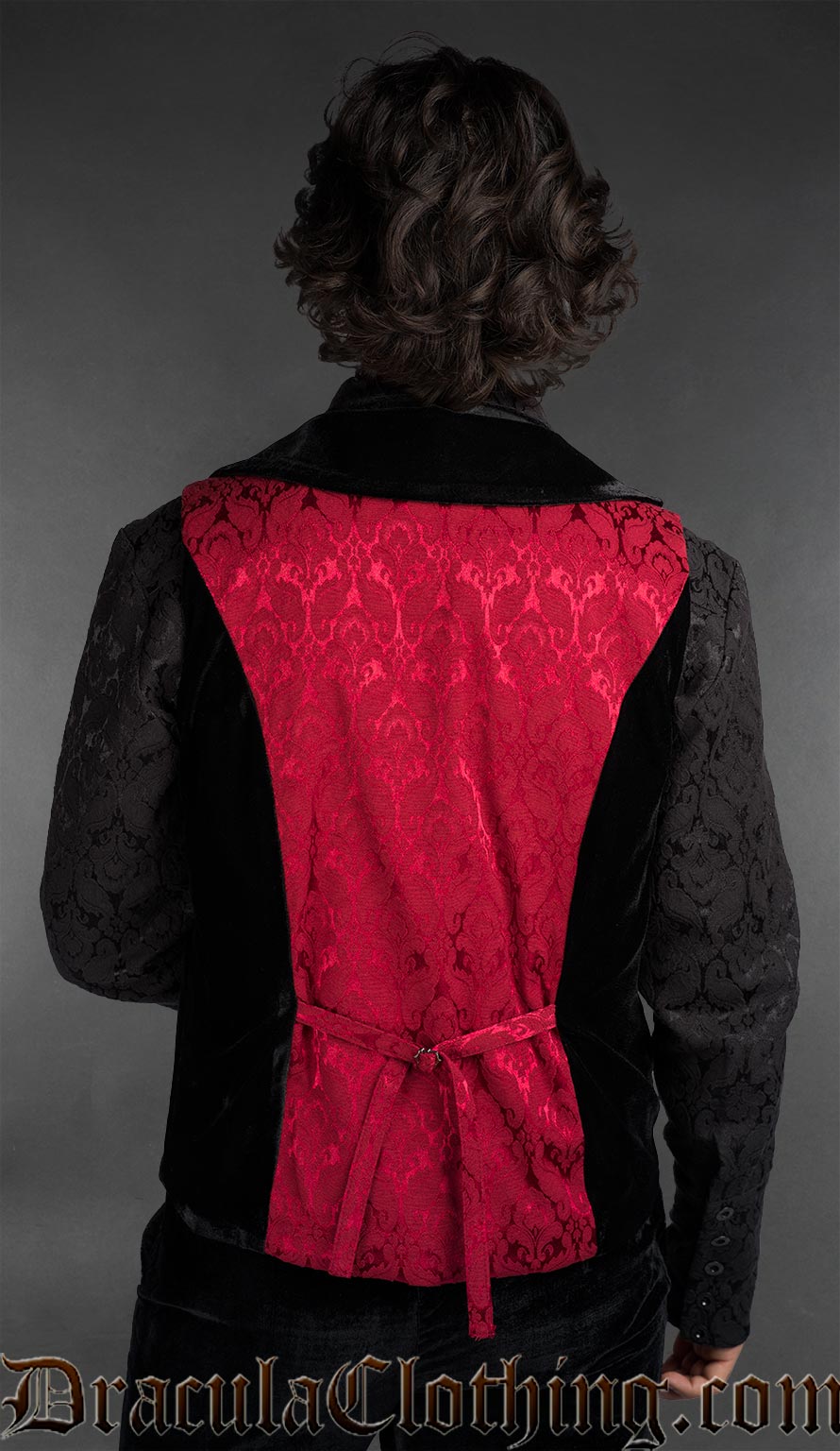 Back view of Men’s red brocade gothic vest with black velvet details worn over black shirt