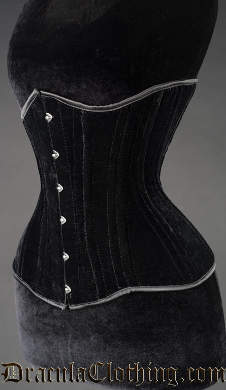 Side view of women's black velvet corset showing extreme waist style shaping