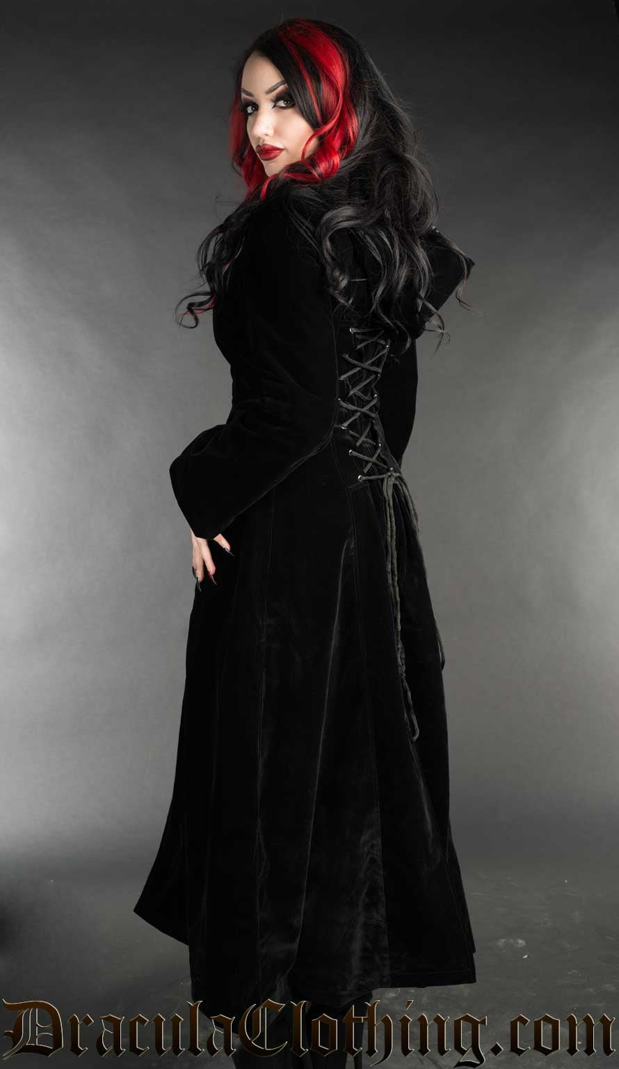 Back view of women's long black velvet coat showing adjustable corset lacing in the back and attached hood