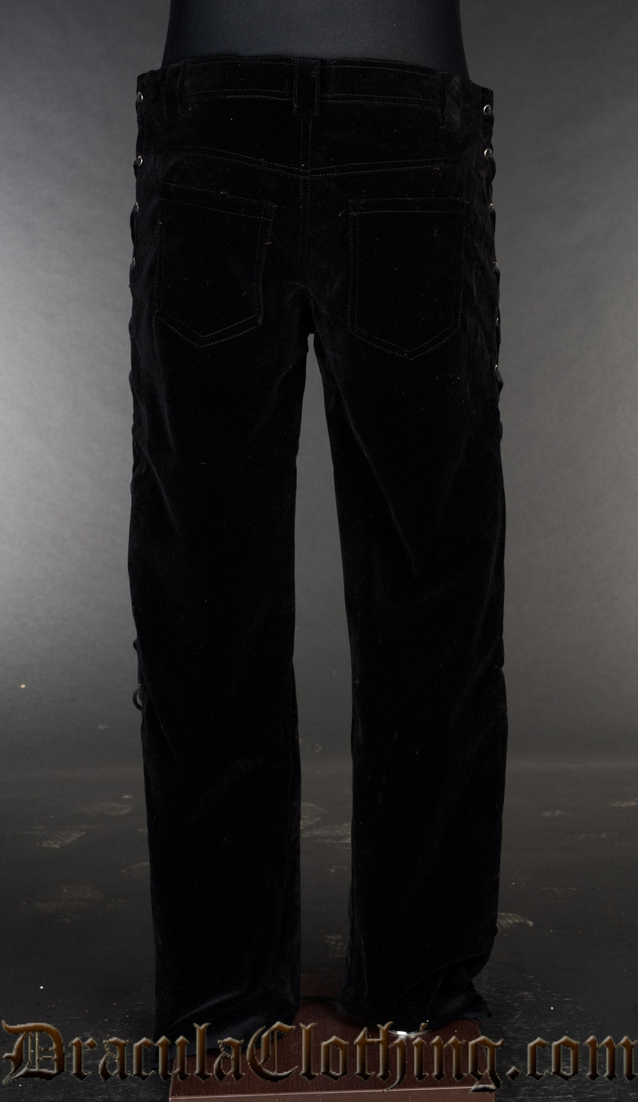 Back view of men's black velvet side laced pants
