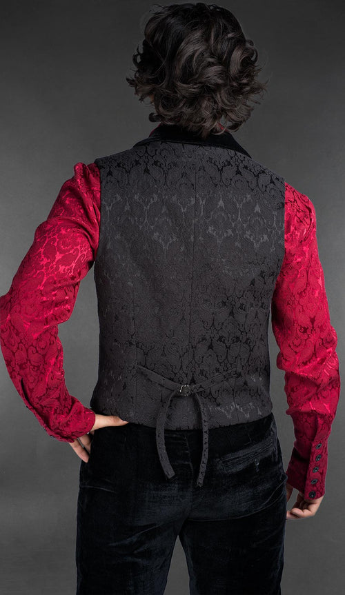 Back view of Men’s black brocade gothic vest with black velvet lapel, worn over a red patterned shirt, Victorian alternative fashion