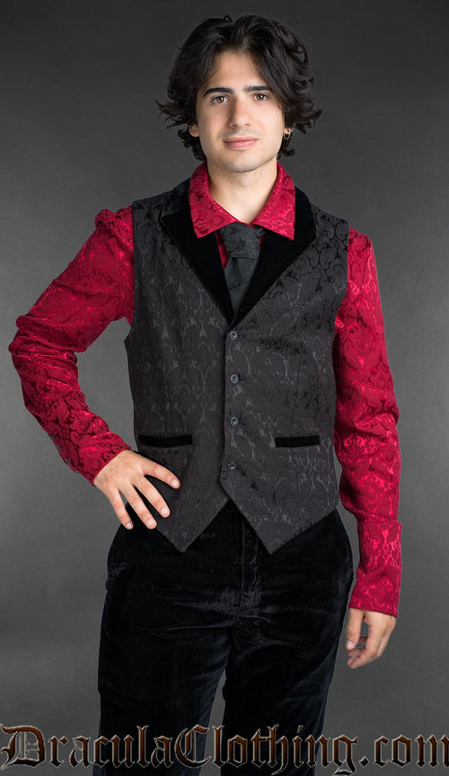 Men’s black brocade gothic vest with black velvet lapel, worn over a red patterned shirt, Victorian alternative fashion