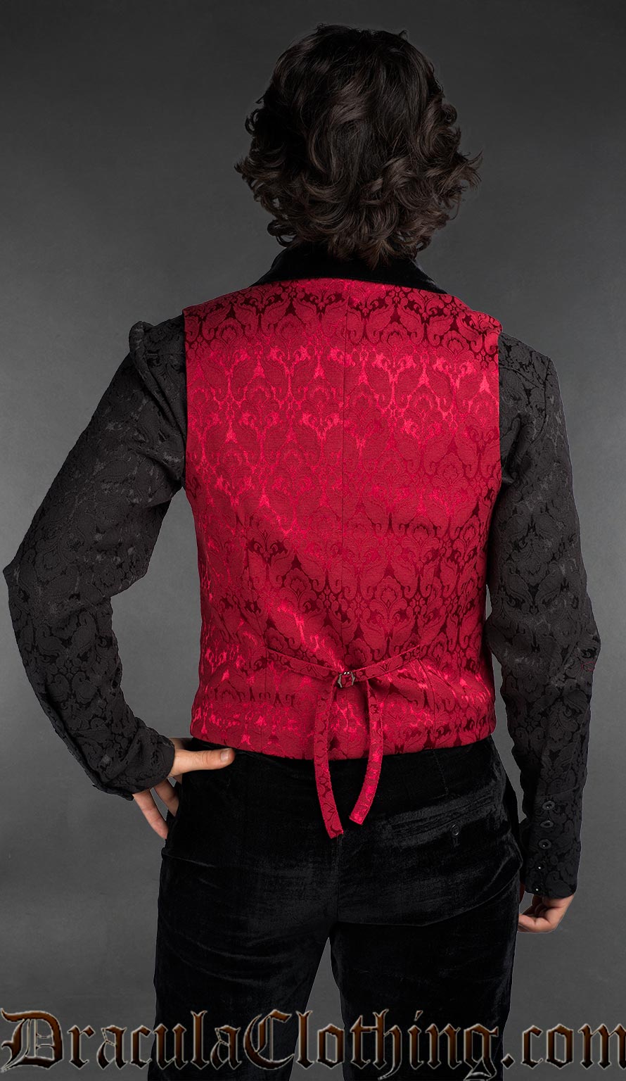 Back view of Men’s red brocade gothic vest with black velvet lapel, Victorian alternative waistcoat worn over a black shirt
