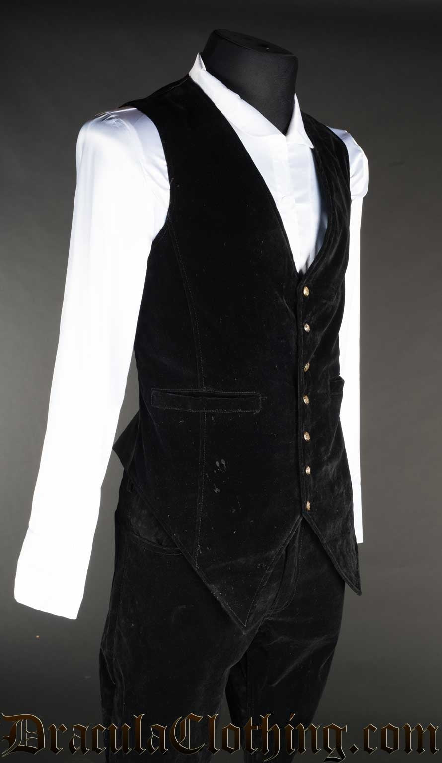 Side view of black pointed forked velvet vest