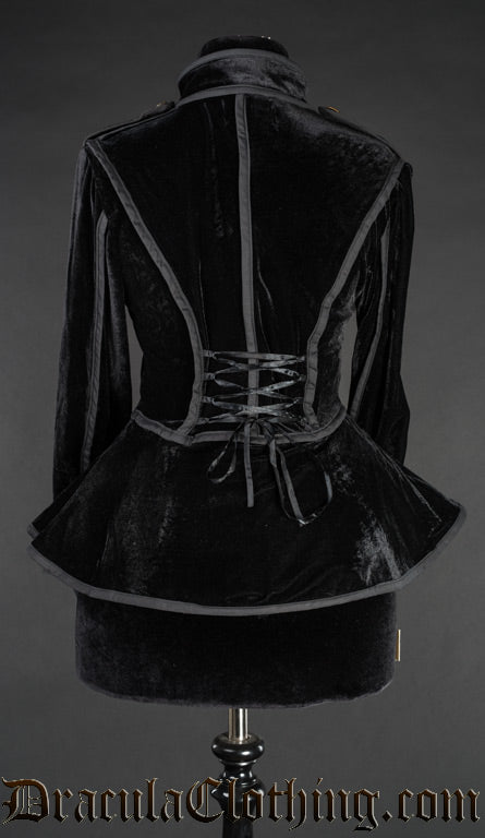 Back view of black velvet military jacket for women showing adjustable corset style lacing in the back and skirt hem