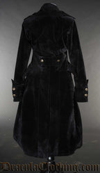 Back view of women's black velvet pirate inspired coat showing gold coloured button details on sleeve cuffs and half belt