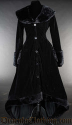 Women's deep black velvet high low winter coat with faux fur accents and pockets