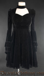 Women's black velvet long sleeved dress with queen anne neckline and high collar