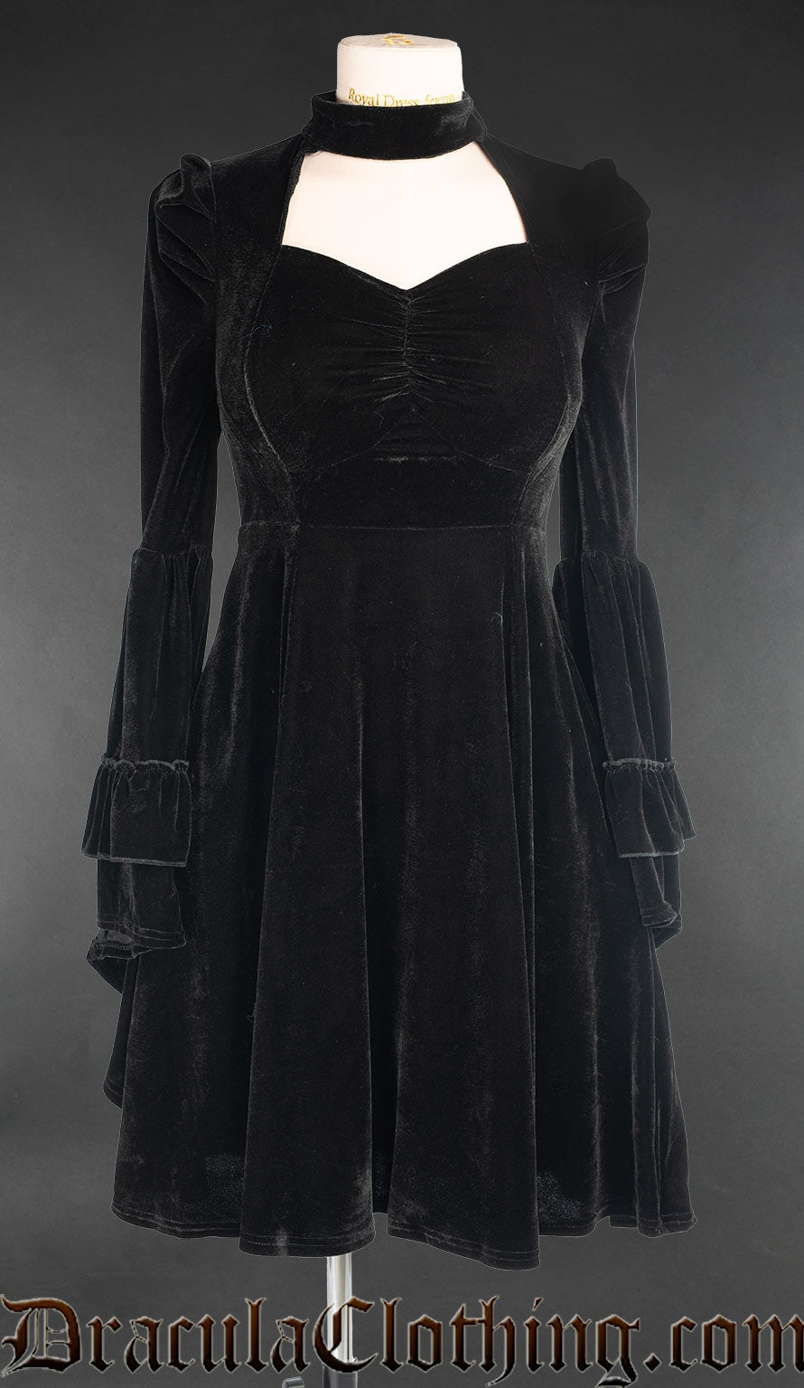 Women's black velvet long sleeved dress with queen anne neckline and high collar