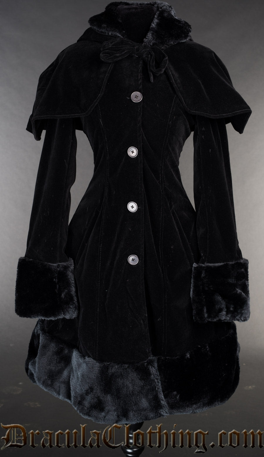 Dark black women's winter coat made with velvet and faux fur accents shown with detachable cape