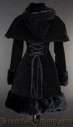 Back view of women's black velvet winter coat showing detachable cape and adjustable corset style lacing in the torso