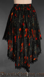 Back view of violin print women's black high low skirt showing longer back than front and black lace trim hem