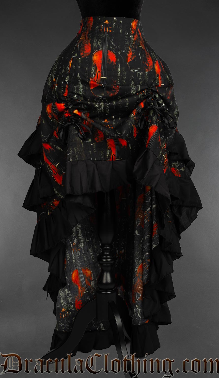 Front view of women's bustle skirt with violin print showing the front raised by two strings