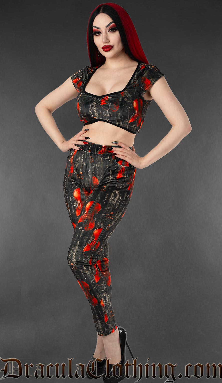 High waisted women's velvet leggings with pockets and a violin print on a black and grey background