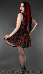 Back view of printed velvet women's short dress with violin design showing adjustable lacing in the back