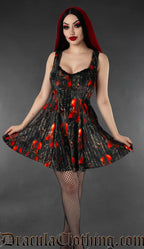 Short women's sleeveless dress made with violin printed velvet