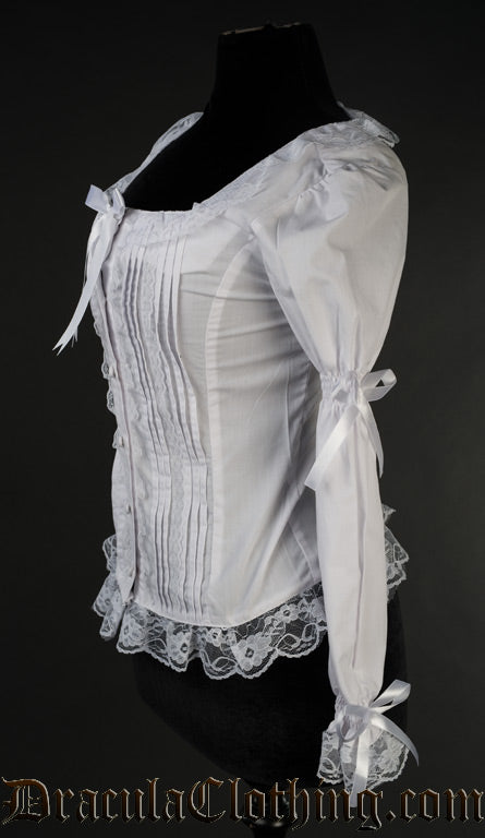 Side view of white blouse showing elastic in the long sleeves and ribbon bow details