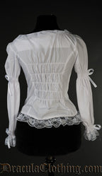 Back view of women's white blouse showing elasticated back panel for fitted style and lace hem trim